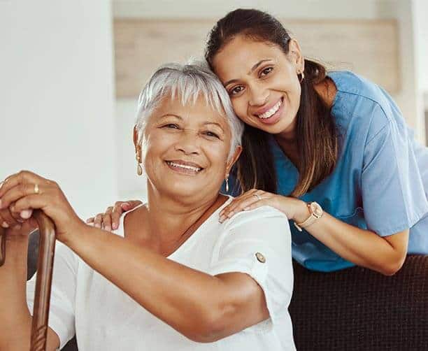 Nurse And Patient Smiling
