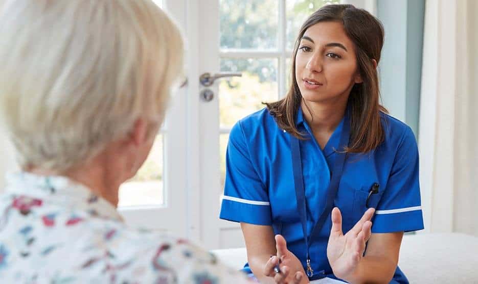 Nurse Talking To Elderly Woman